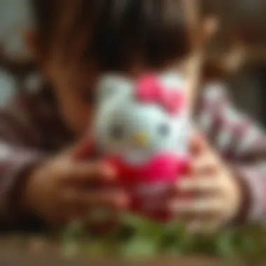 Close-up of a child playing with a Hello Kitty egg